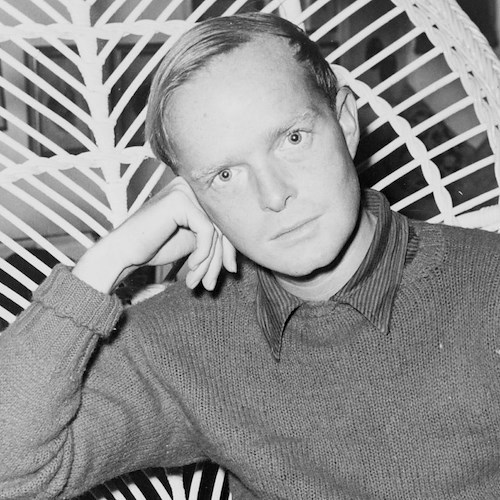 Truman Capote, half-length portrait, facing front, seated in a chair, resting head on his right hand, holding cigarette in his left hand / World Telegram & Sun photo by Roger Higgins